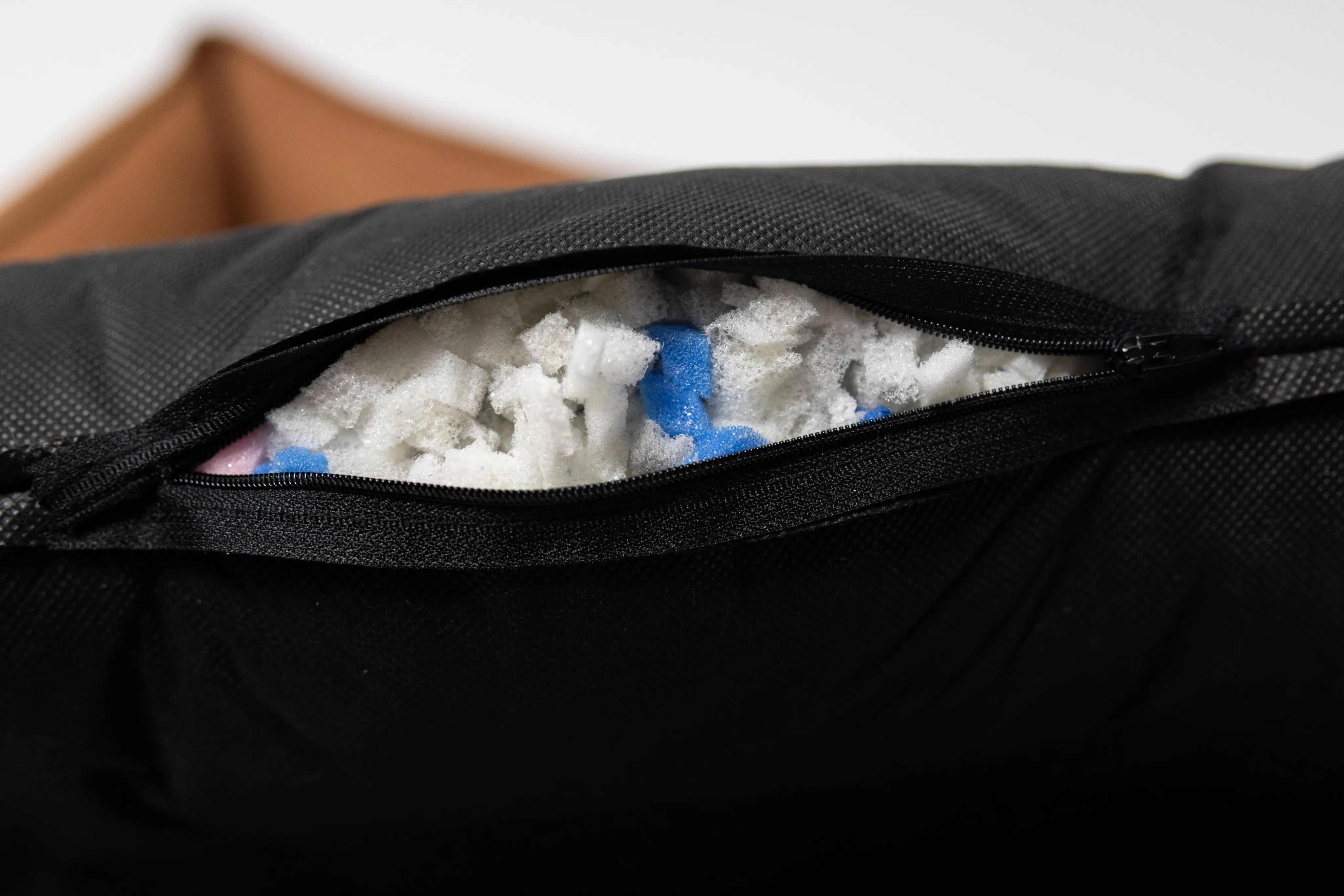 Granulated memory foam orthopedic filling inside the cushion